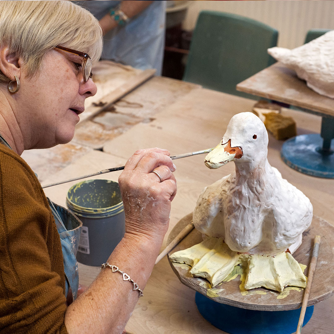 painting a ceramic duck