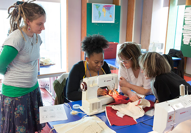 students using a sewing machine