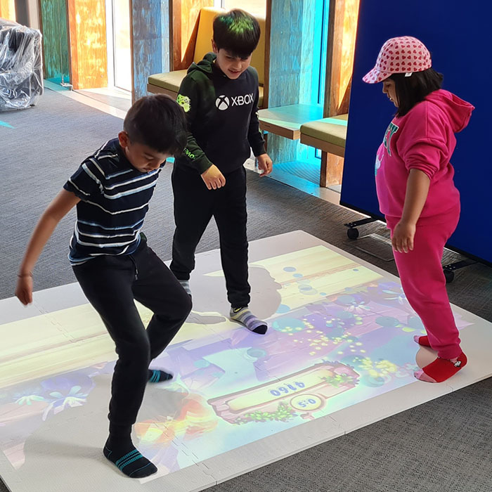 children playing on interactive mat