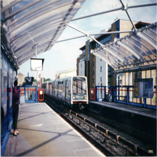 women waiting for DLR train at Limehouse Station 