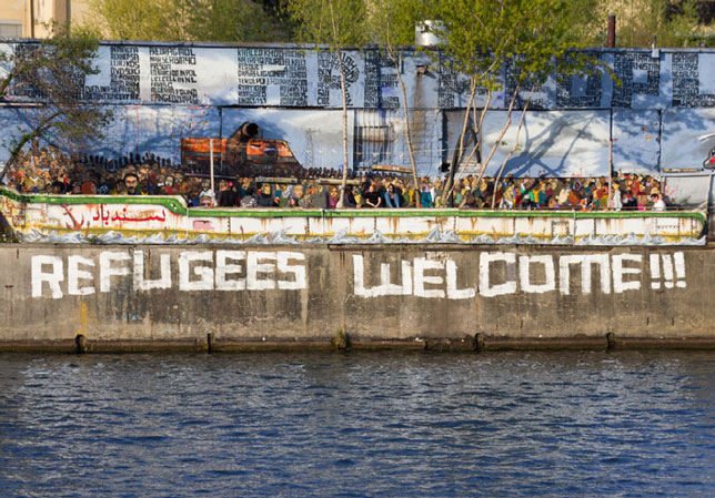 refugees welcome painted on wall