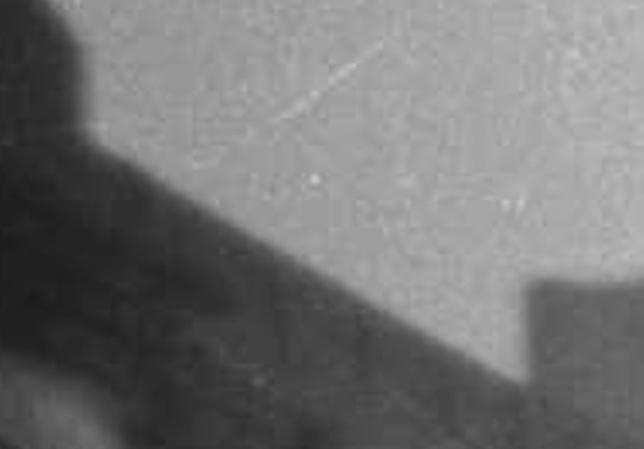 Black white photo of a woman standing on a barge on the Regent's Canal