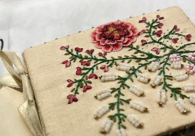 close up of embroidery on handmade needle book