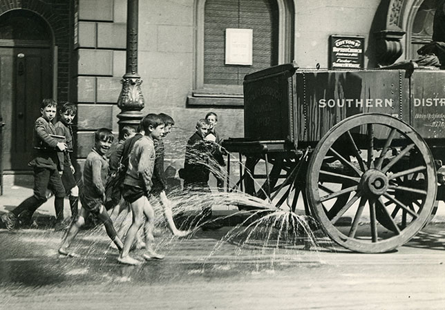 Children following water-cart, 1919 Photographer - William Whiffin