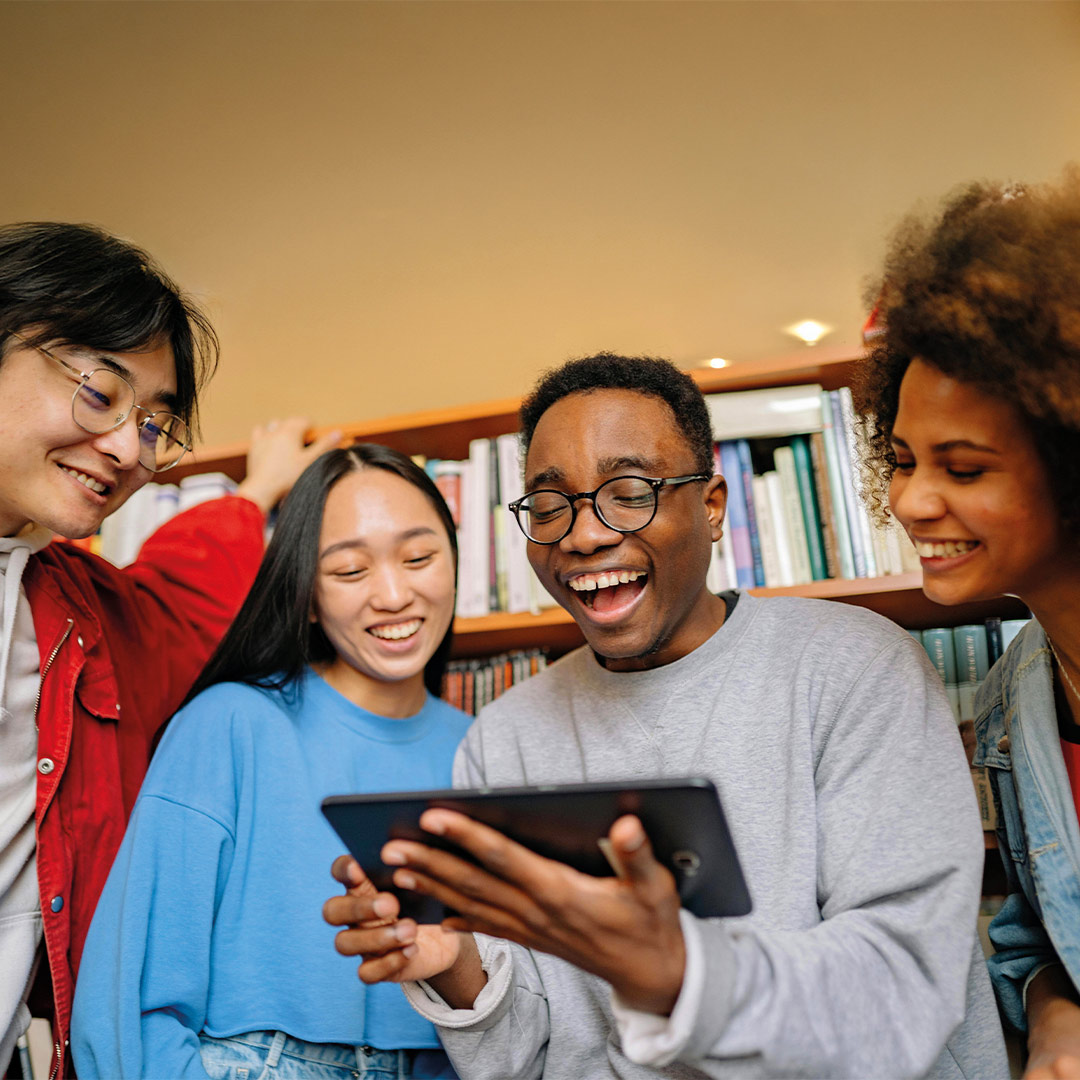 students looking at a book