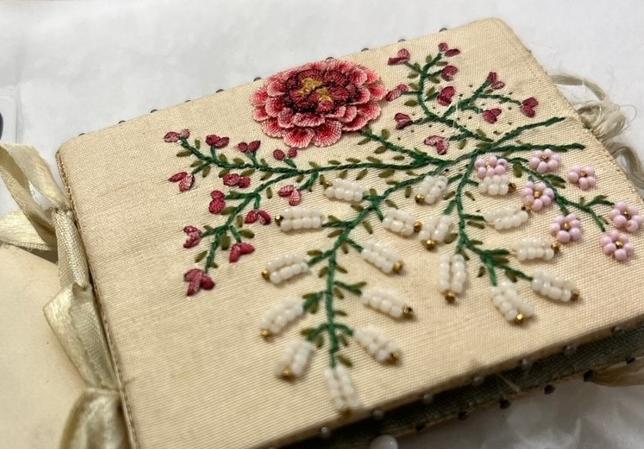 close up of embroidery on handmade needle book